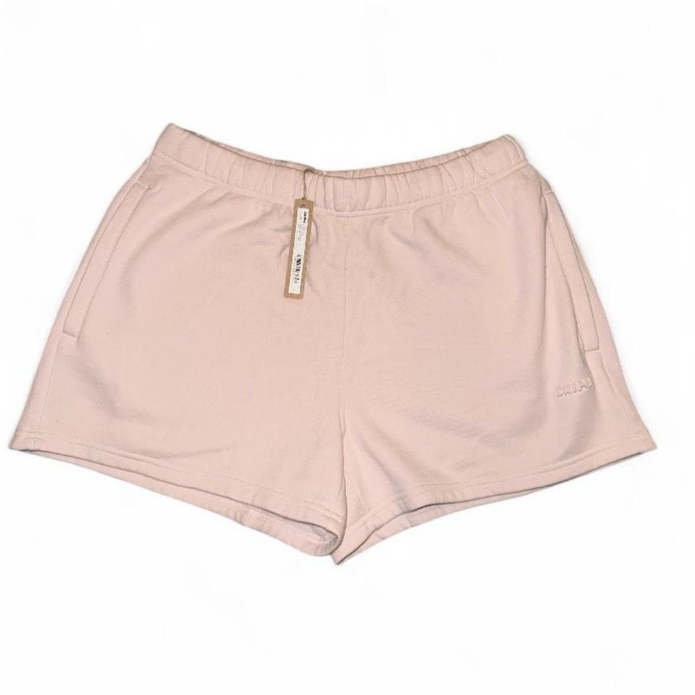 skims pink sweatshorts